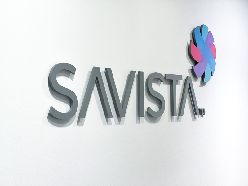 Signage of the Savista logo on the wall of the Savista office